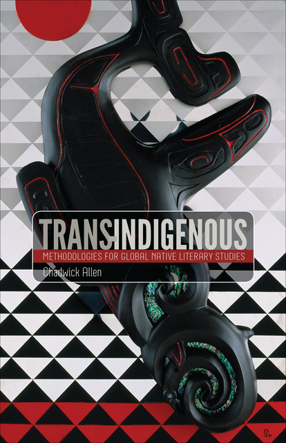 Native American sculpture in dark-colored wood against a triangle-patterned background.