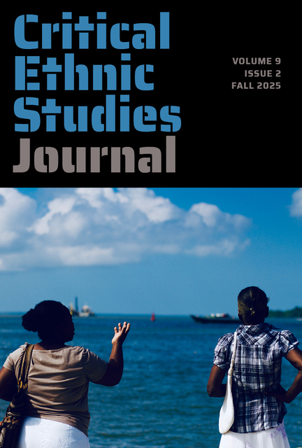 Issue information in black bar above photo of two people seen from behind looking onto a waterway with a small boat in the distance.